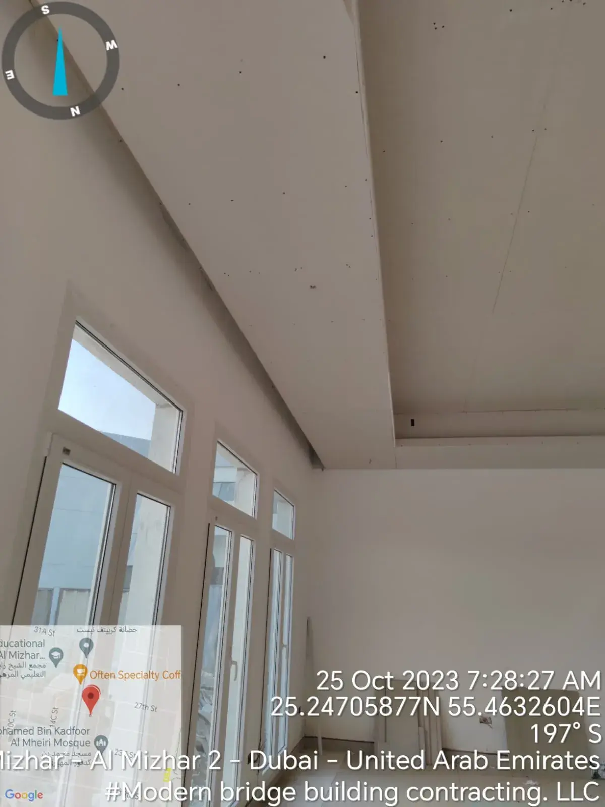 Room with tall windows and gypsum ceiling bulkhead
